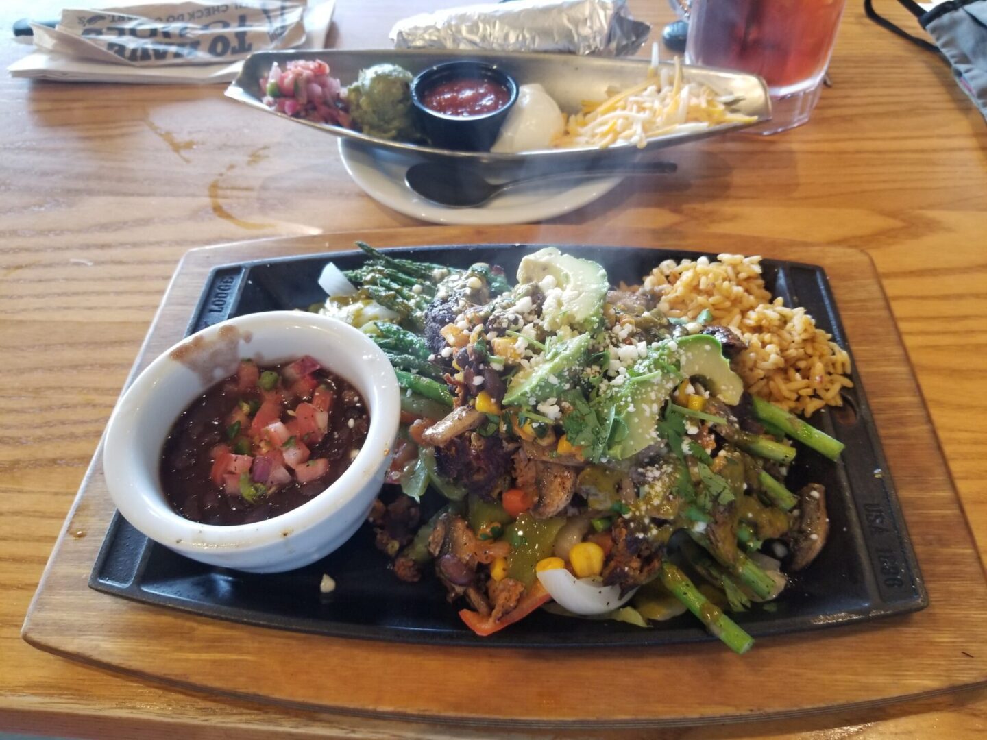 Delicious hot food set on wooden table