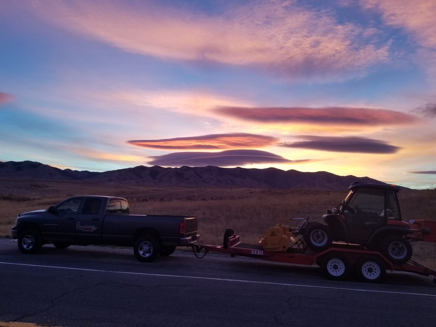 Landscape view of pickup truck with beautiful sunset