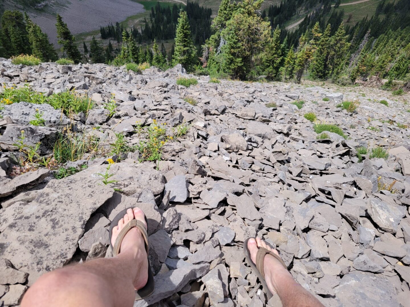 Man sitting over tailings piles leftover