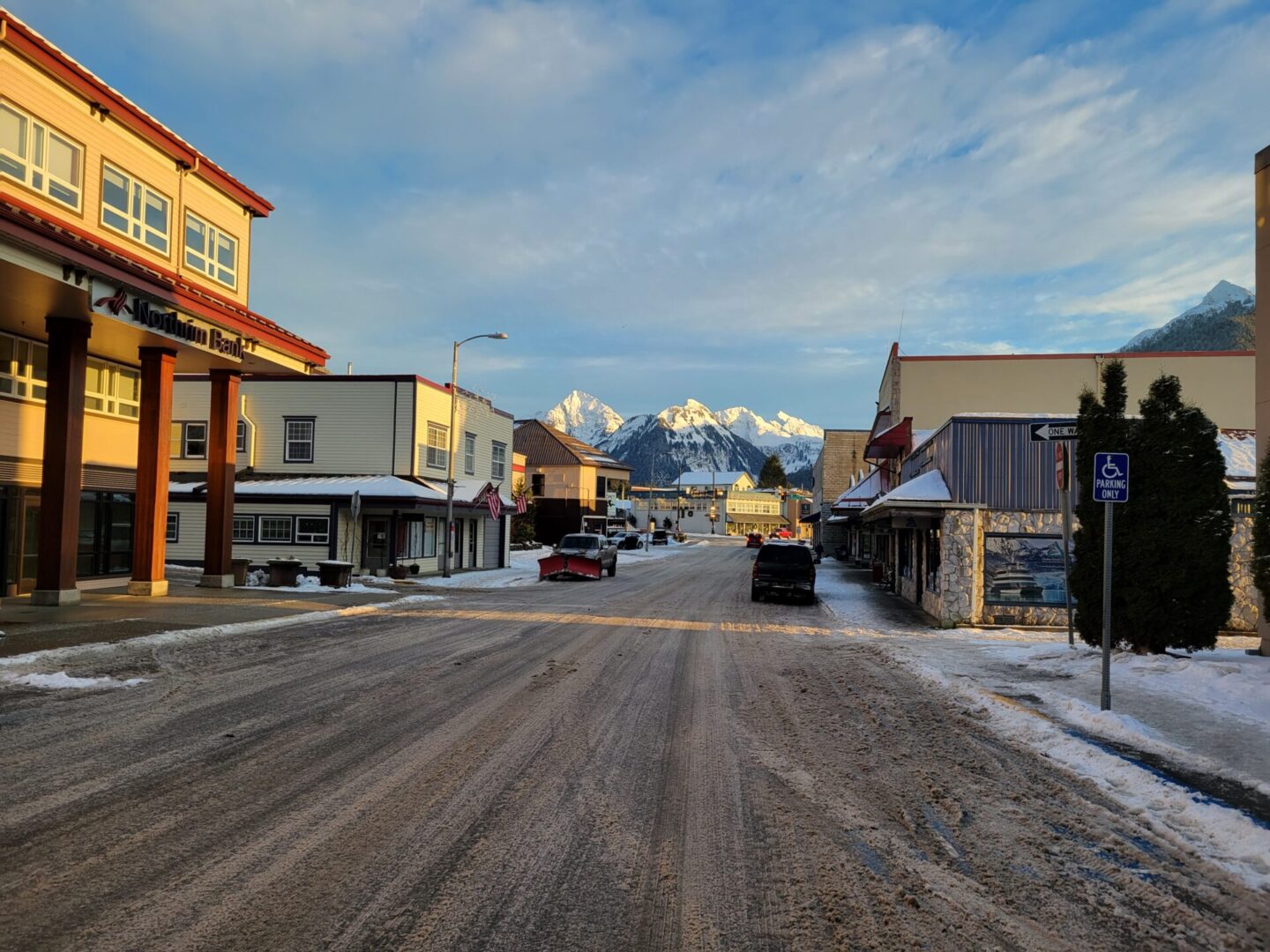 A scenic view with snow capped mountains