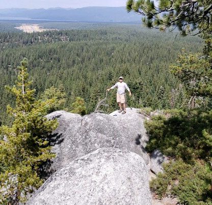 Man stops while hiking for a scenic view