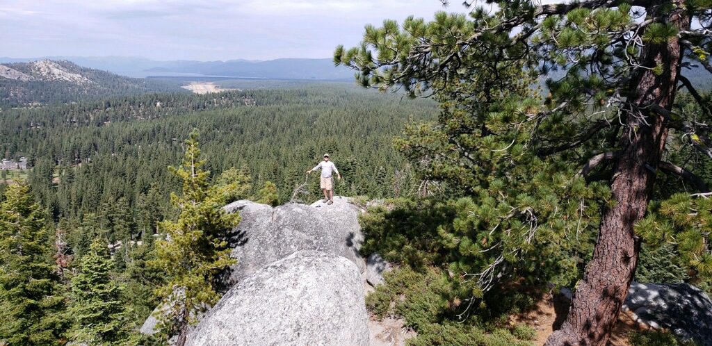 Man stops while hiking for a scenic view